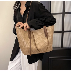 Minimalist woven leather tote bag in camel with slim shoulder straps for daily use