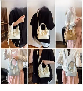 Model display of crocodile pattern bucket bag with silk scarf handle and gold buckle