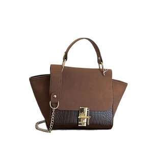 Brown crocodile embossed patchwork crossbody bag with metal chain strap and top handle