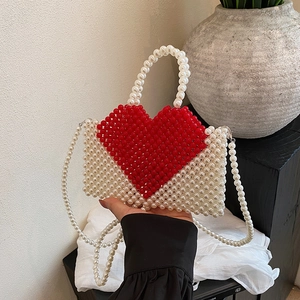 Handmade red heart pearl beaded tote bag with crossbody strap for elegant women