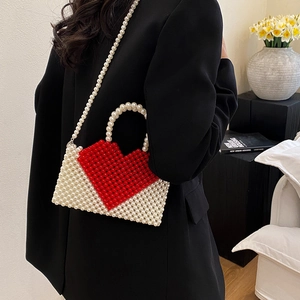 Handmade beaded heart handbag with white pearls and red heart pattern for crossbody use
