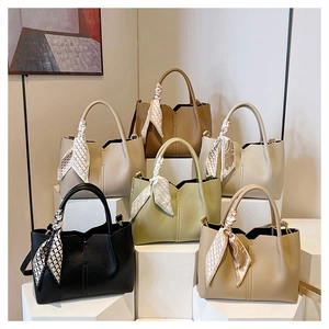 Litchi texture tote bags in six colors with decorative scarves on geometric stands