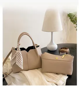 Apricot tote bag with lychee texture and inner pouch featuring silk scarf and gold hardware
