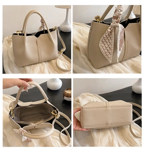 Detail view of beige lychee leather tote with printed silk scarf and adjustable strap