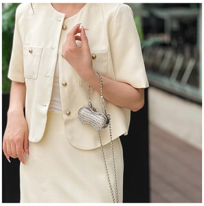 Silver peanut-shaped mini evening bag with sparkling rhinestones and a metal bead chain