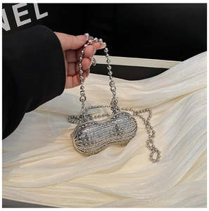 Macro shot of a peanut-shaped evening clutch bag with sparkling encrusted rhinestones
