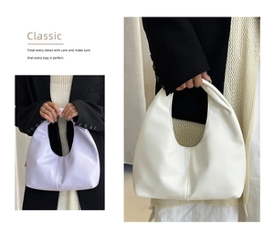 Detail of matte leather hobo bags in lilac and cream with vertical stitching detail