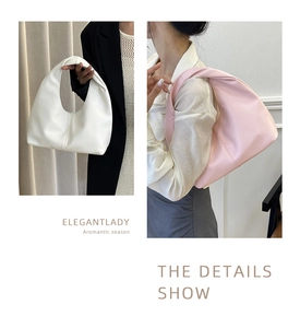 Detail showing white and pink faux leather crescent underarm bags with curved handles