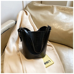 Detail of black crocodile texture bucket bag with Fashion & Bags Leather logo