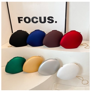 Collection of oval acrylic evening clutch bags in 8 vibrant colors with metal chain