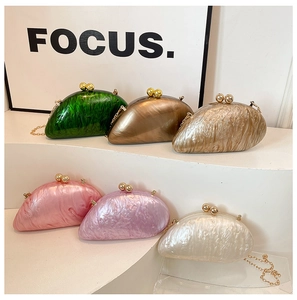 Group of colorful acrylic marble evening clutches with gold snap closure and chain strap