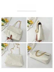 Detail view of white woven texture leather bag with elegant gold chain strap and flap