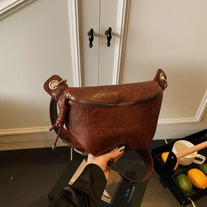 Vintage dark brown crossbody chest bag with textured leather and gold chain detail