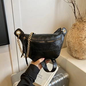 Fashionable black faux leather crescent chest bag with gold chain and wide strap