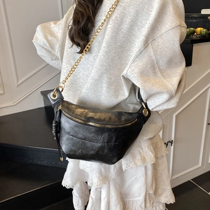 Retro black crescent moon fanny pack with chunky gold chain strap and textured leather finish