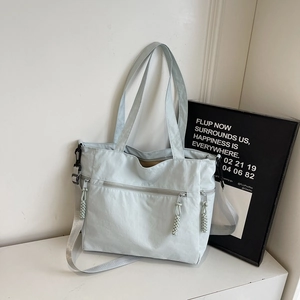 Large capacity blue-grey tote bag with adjustable strap and multiple storage pockets