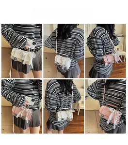 Detail view of small crossbody bag with lace bow and vintage buttons in pink and white