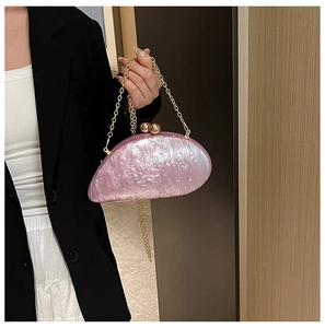 Pink acrylic marble pattern evening clutch bag with gold sphere clasps and chain strap