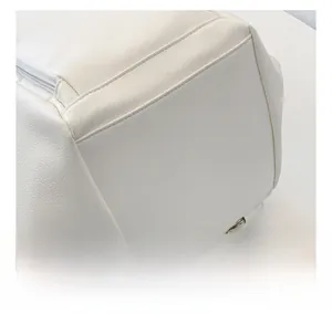 Close-up of white lychee pattern faux leather texture with neat stitching and zipper detail
