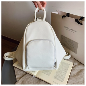 Detail of white lychee pattern PU leather backpack with minimalist triangular silhouette