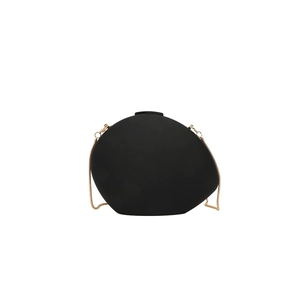 Minimalist black oval evening clutch bag with gold snake chain strap on white background