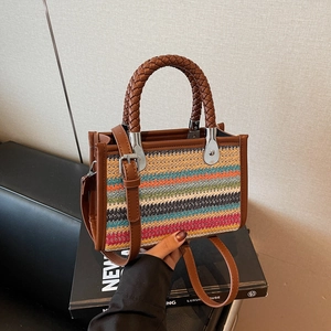 Rainbow woven hand bag with striped pattern and brown handles for trendy casual styling