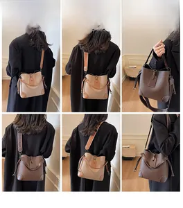 Detailansicht der Eimer-Handtasche mit breitem Gurt in Umhänge- und Handtragestilen