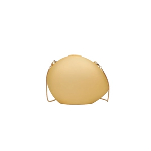 Oval acrylic shell clutch in light yellow matte finish with a gold chain strap