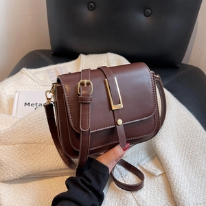 Chic dark brown square crossbody bag in matte faux leather with elegant gold metal buckle