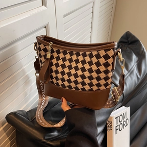 Retro houndstooth bucket bag with wide jacquard strap and premium brown leather finish