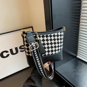 Classic houndstooth bucket bag with wide jacquard shoulder strap and gold hardware