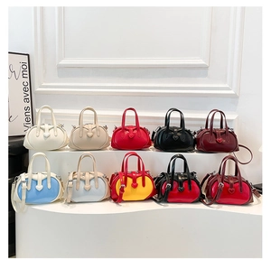 Collection of mini Boston crossbody bags in ten vibrant colors with heart details