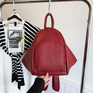 Red lychee texture fashion backpack with side wings and large curved front pocket
