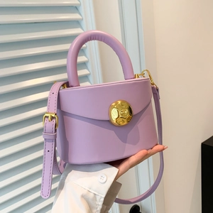Lavender purple minimalist handbag with gold spherical buckle and top handle strap