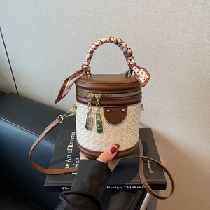 Brown leather and beige woven bucket bag with silk scarf handle and golden hardware