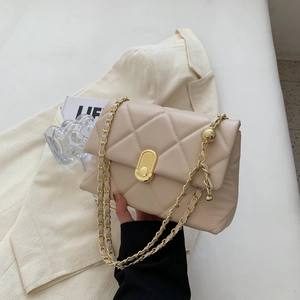 Quilted beige leather handbag with gold chain strap and elegant oval clasp buckle