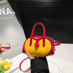 Mini red and yellow contrast leather handbag with heart buckle and detachable strap