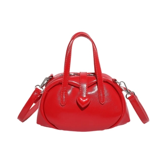 Bright red glossy Boston handbag with a sweet heart detail and detachable shoulder strap