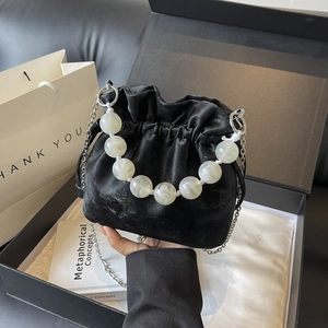 Chic black velvet drawstring bucket bag with marble beaded handle and silver chain