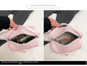 Detailansicht der rosa Handtasche mit Fokus auf das Hauptfach und Innenfutterstruktur