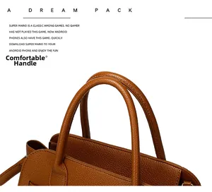 Close-up of comfortable double handles on a brown lychee pattern leather tote bag