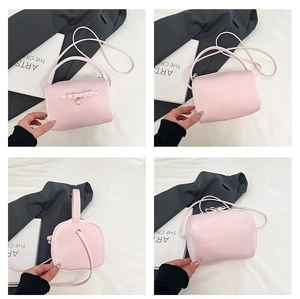 Rosa Handtasche mit Schleife aus verschiedenen Perspektiven mit edlem Perlenanhänger