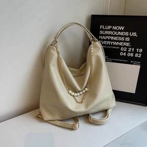 Versatile cream faux leather tote bag with elegant pearl and gold chain straps