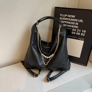 Chic black faux leather backpack with elegant pearl and gold chain strap decoration