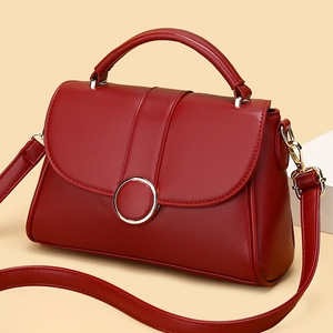 Red French minimalist shoulder bag with gold round metal buckle and top handle