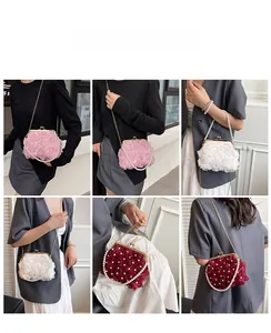 Detailed view of 3D fabric rose texture and pearl accents on elegant floral evening handbags