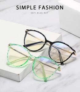 Close-up of retro TR90 anti-blue light glasses with metal temples and round frames