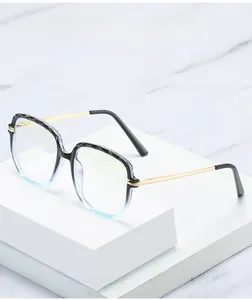 Detail of retro gradient TR90 blue light blocking glasses on marble pedestal