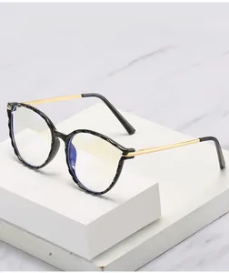 Detail of retro round TR90 frames with anti-blue light lenses and gold metal temples