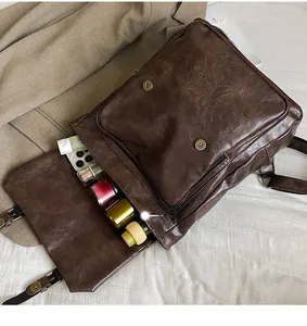 Interior storage of vintage dark brown faux leather backpack showing space for essentials